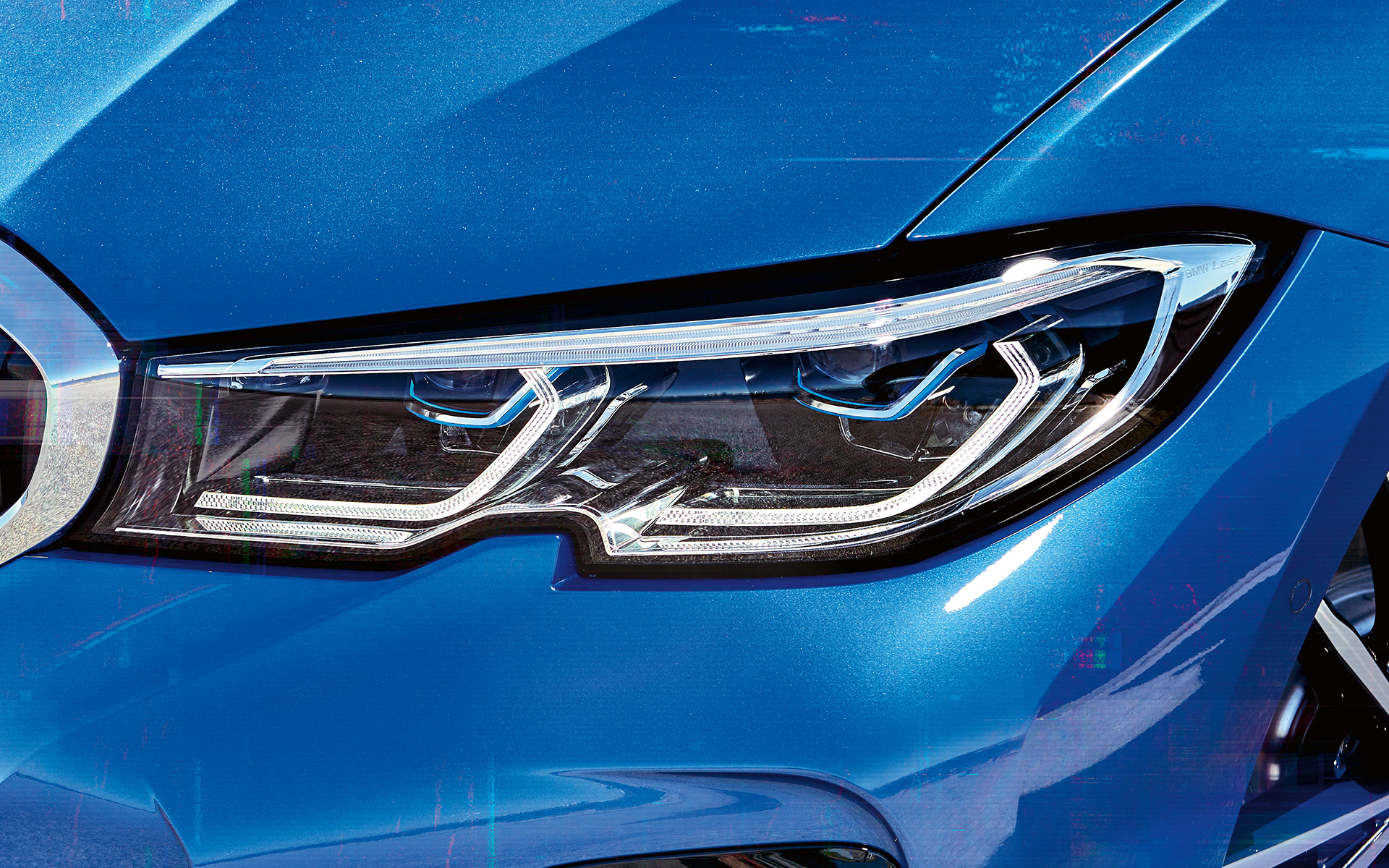 BMW 3 Series Sedan (G20), BMW Laserlight. Lateral close-up of the right front headlights with BMW laserlight.